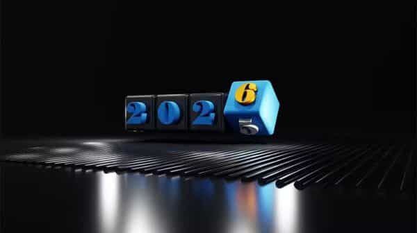 Et digitalt display med "2025", der skifter til "2026", lyser oven på en sort reflekterende overflade med blå og gule accenter, der indfanger ånden i FutureNode-innovation.