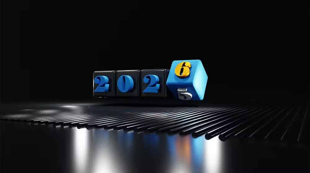 Et digitalt display med "2025", der skifter til "2026", lyser oven på en sort reflekterende overflade med blå og gule accenter, der indfanger ånden i FutureNode-innovation.